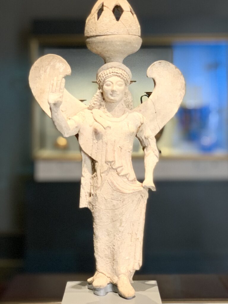 Stone sculpture of the winged goddess Nike.